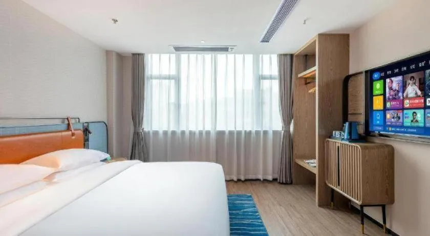 Bed in Echarm Hotel Guangzhou North Station Cultural Tourism City