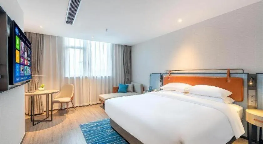 Bed in Echarm Hotel Guangzhou North Station Cultural Tourism City