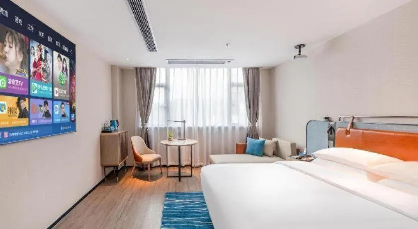 Bed in Echarm Hotel Guangzhou North Station Cultural Tourism City