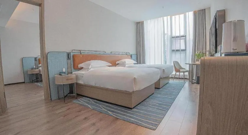 Bed in Echarm Hotel Zigong Machishui Wanda Plaza