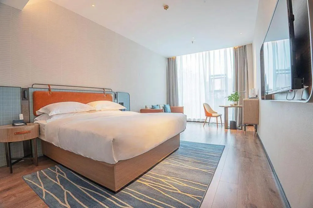 Bed in Echarm Hotel Zigong Machishui Wanda Plaza