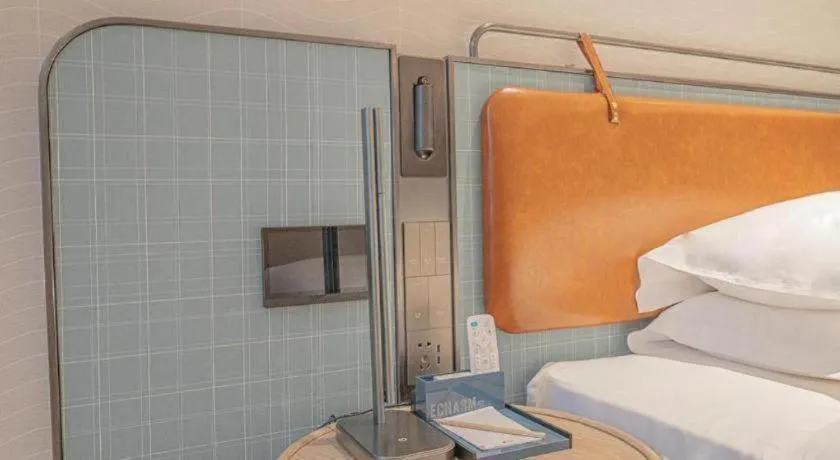 Bed in Echarm Hotel Zigong Machishui Wanda Plaza