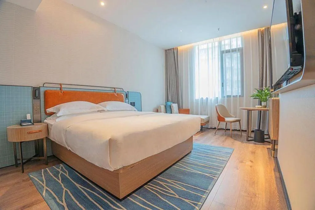 Bed in Echarm Hotel Zigong Machishui Wanda Plaza