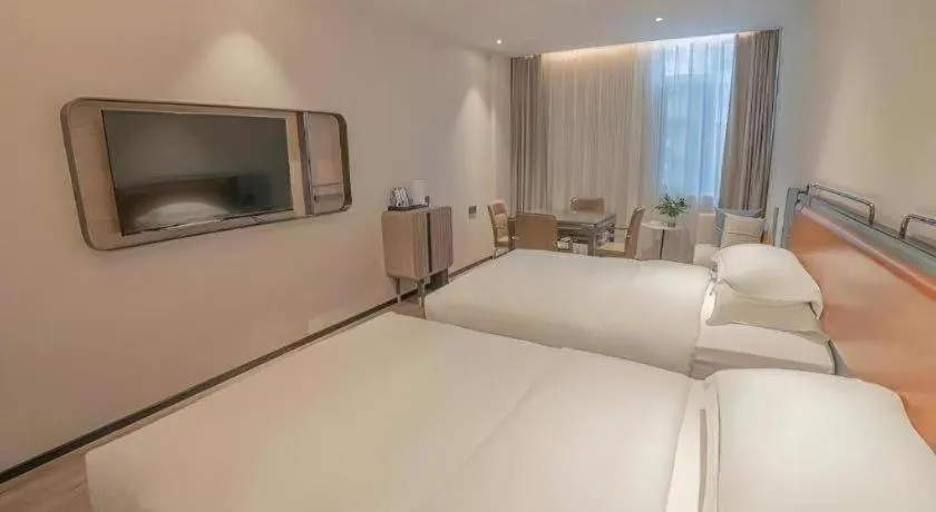 Bed in Echarm Hotel Zigong Machishui Wanda Plaza
