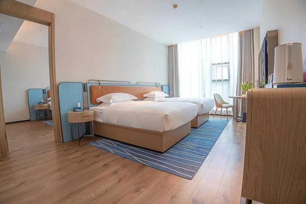 Bed in Echarm Hotel Zigong Machishui Wanda Plaza