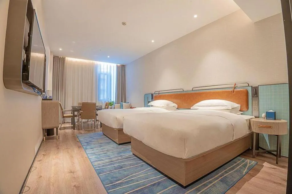 Bed in Echarm Hotel Zigong Machishui Wanda Plaza