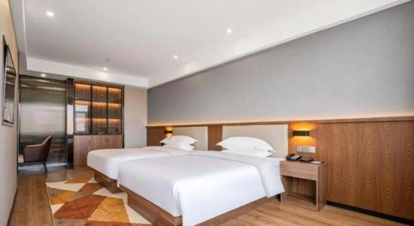 Bed in Borrman Hotel Zoucheng Huamaowan Mall