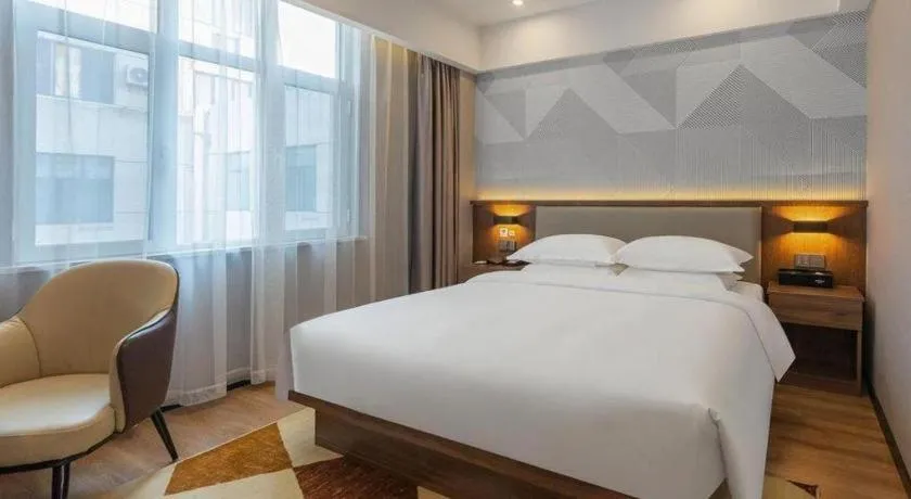 Bed in Borrman Hotel Zoucheng Huamaowan Mall