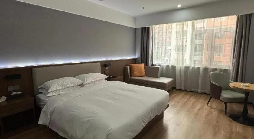 Bed in Borrman Hotel Zoucheng Huamaowan Mall