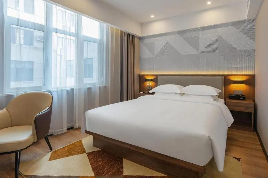 Bed in Borrman Hotel Zoucheng Huamaowan Mall