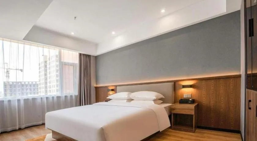 Bed in Borrman Hotel Zoucheng Huamaowan Mall