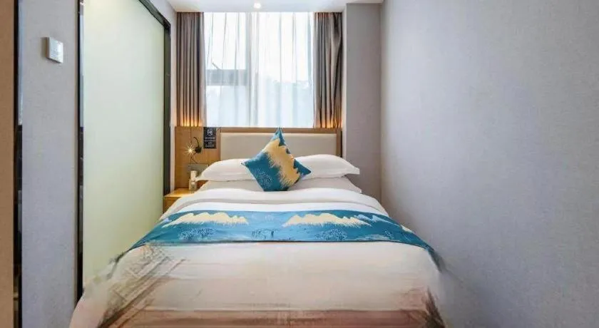 Bed in Borrman Hotel Nanning Anji Passenger Station Xijin Metro Station