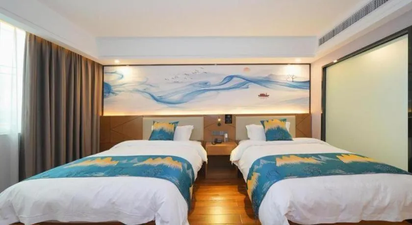 Bed in Borrman Hotel Nanning Anji Passenger Station Xijin Metro Station