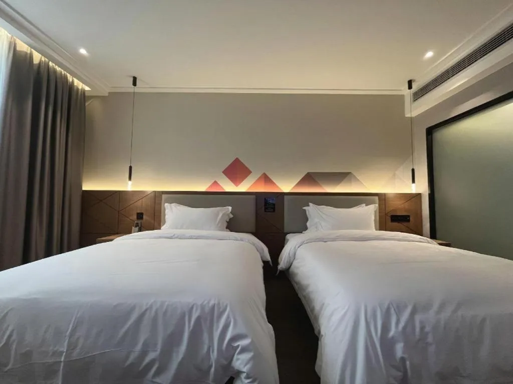 Bed in Borrman Hotel Nanning Anji Passenger Station Xijin Metro Station