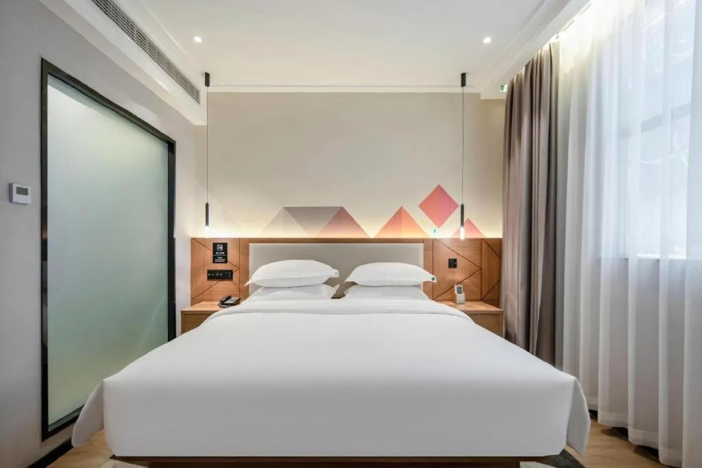 Bed in Borrman Hotel Nanning Anji Passenger Station Xijin Metro Station