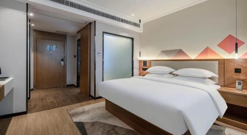 Bed in Borrman Hotel Nanning Anji Passenger Station Xijin Metro Station