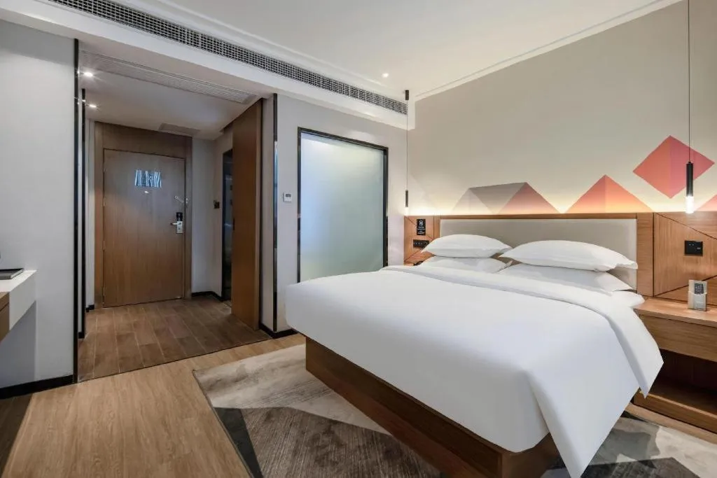 Bed in Borrman Hotel Nanning Anji Passenger Station Xijin Metro Station