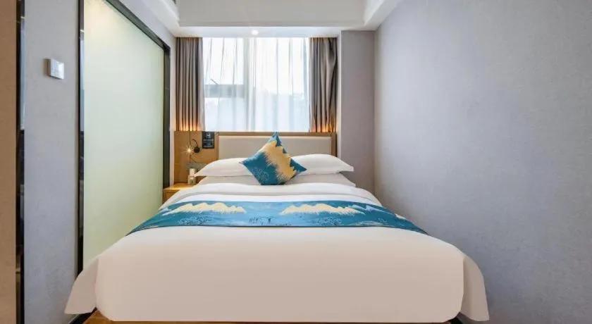 Bed in Borrman Hotel Nanning Anji Passenger Station Xijin Metro Station