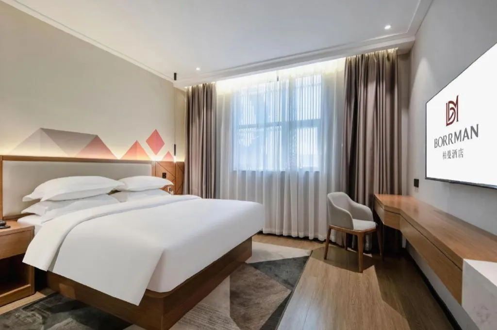 Bed in Borrman Hotel Nanning Anji Passenger Station Xijin Metro Station
