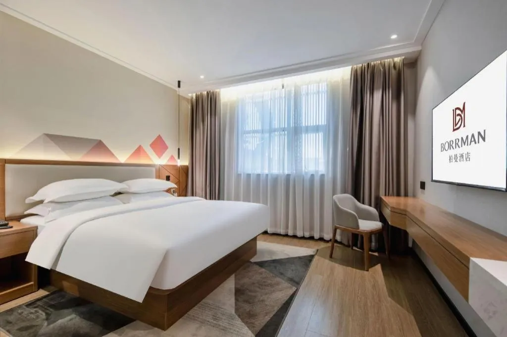 Bed in Borrman Hotel Nanning Anji Passenger Station Xijin Metro Station