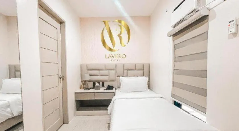 Bed in LAVERO SUITES