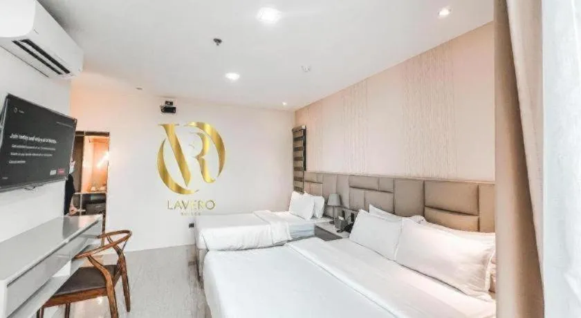 Bed in LAVERO SUITES