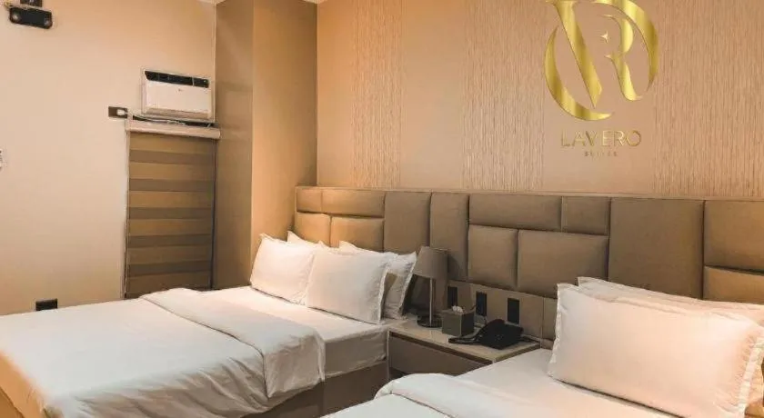 Bed in LAVERO SUITES