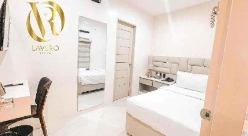 Bed in LAVERO SUITES