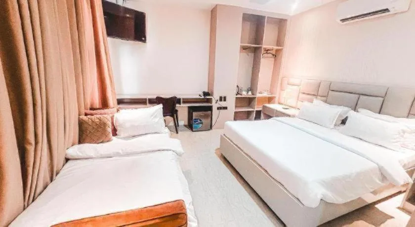 Bed in LAVERO SUITES