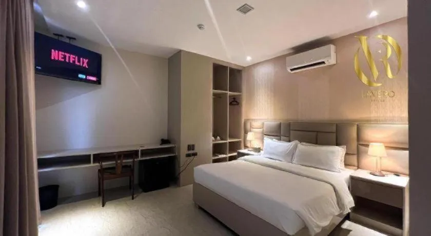 Bed in LAVERO SUITES