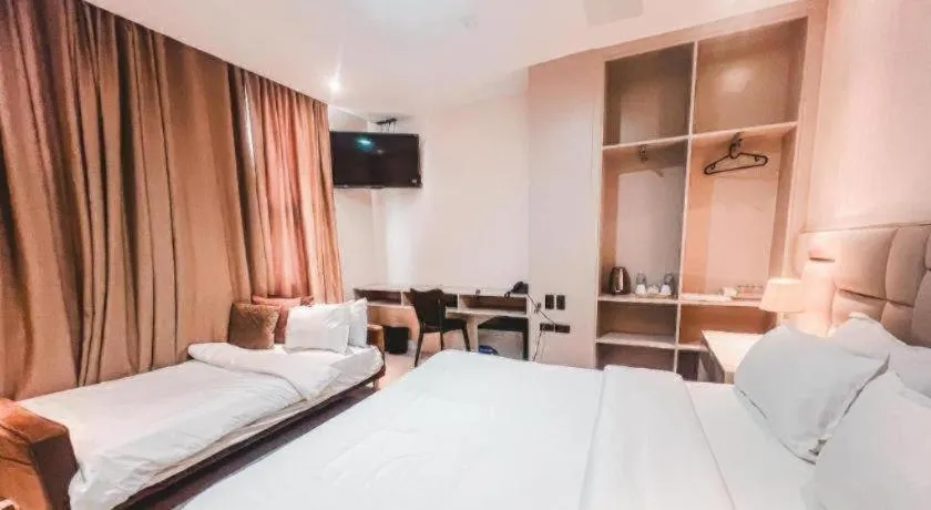 Bed in LAVERO SUITES