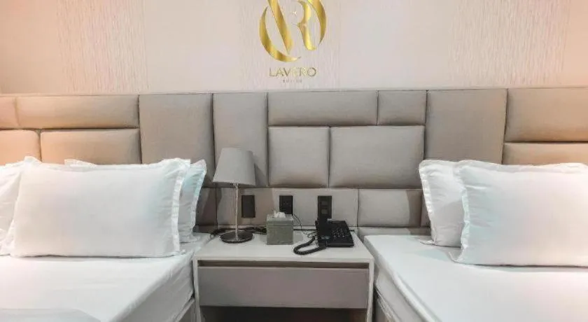 Bed in LAVERO SUITES