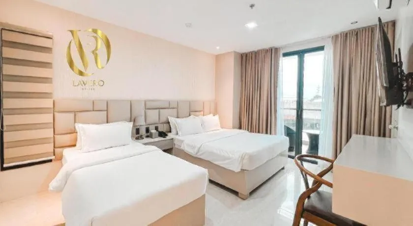 Bed in LAVERO SUITES