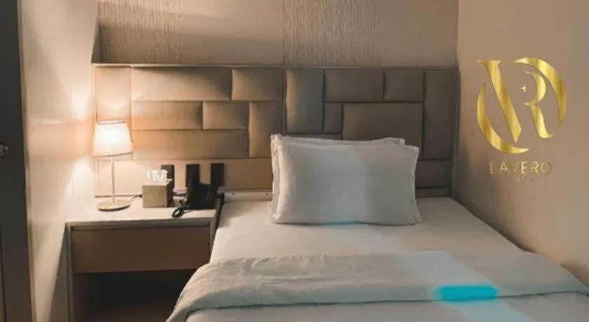 Bed in LAVERO SUITES