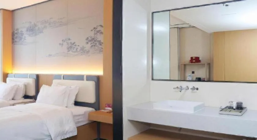 Bed in Ramada Encore by Wyndham Jinan Shanghe