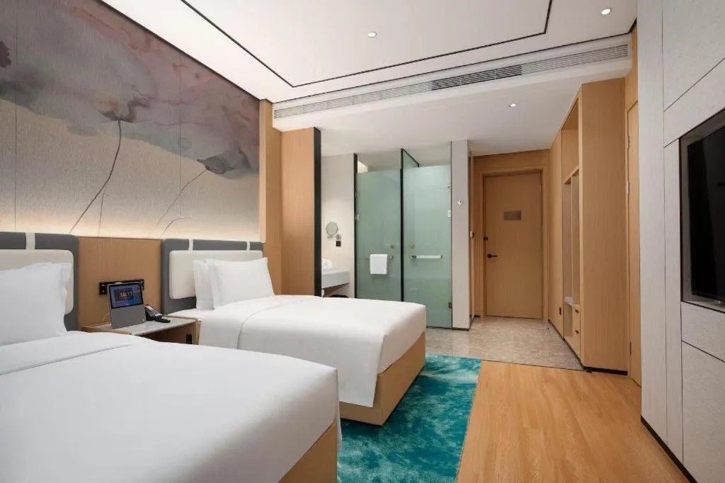 Bed in Ramada Encore by Wyndham Jinan Shanghe