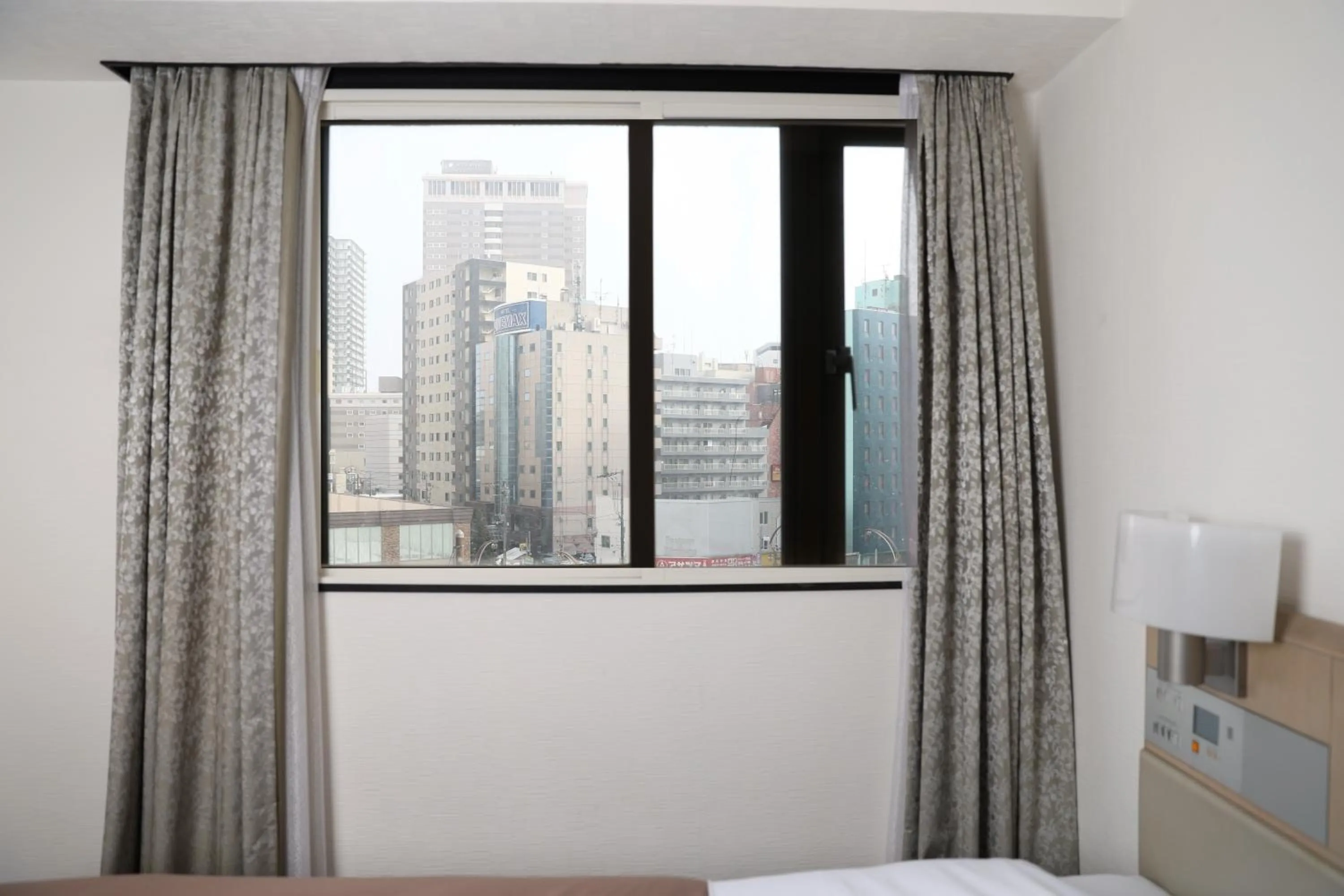 View (from property/room), Bed in Sapporo Oriental Hotel