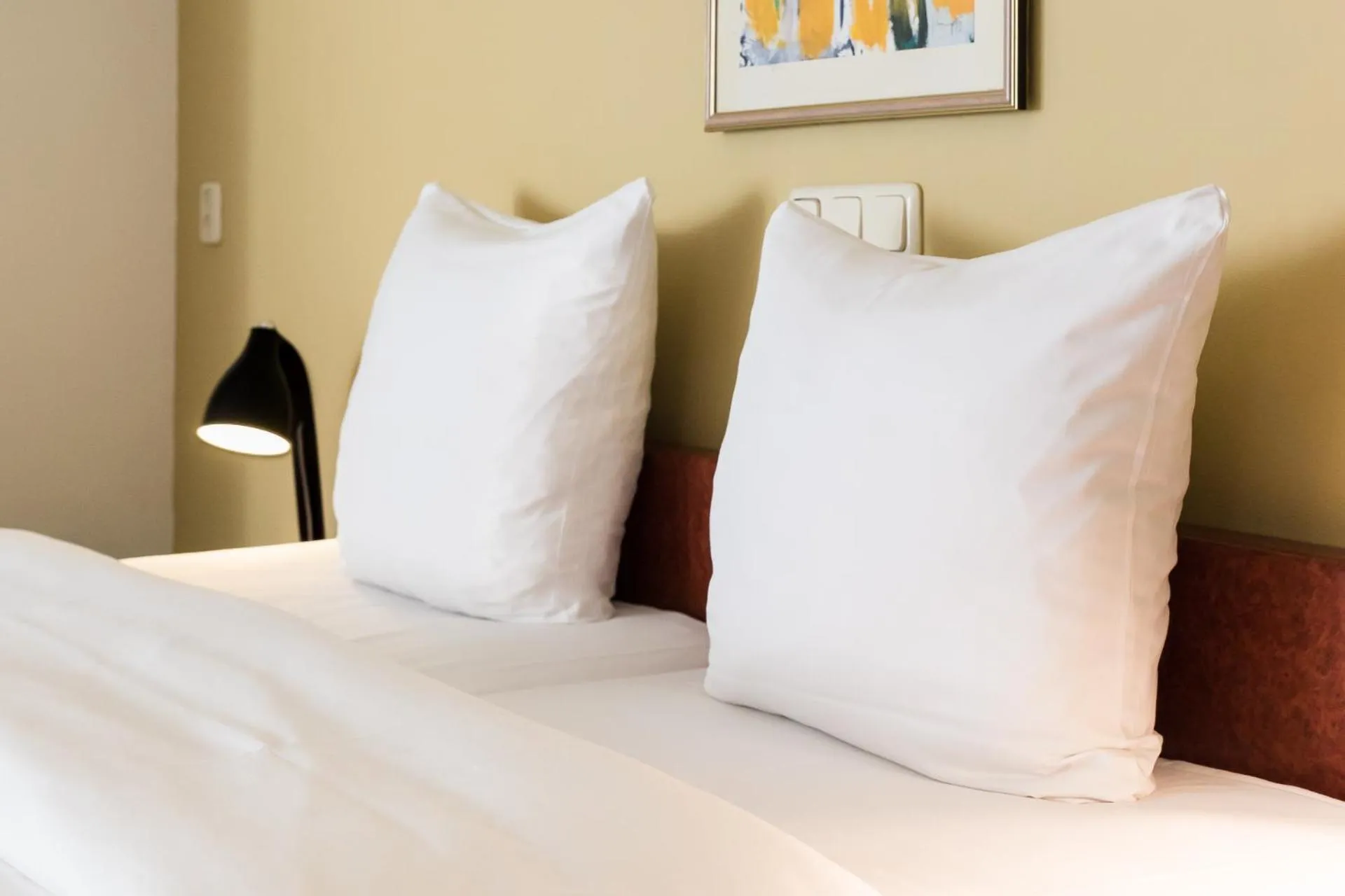 Bed in Prominent Inn Hotel