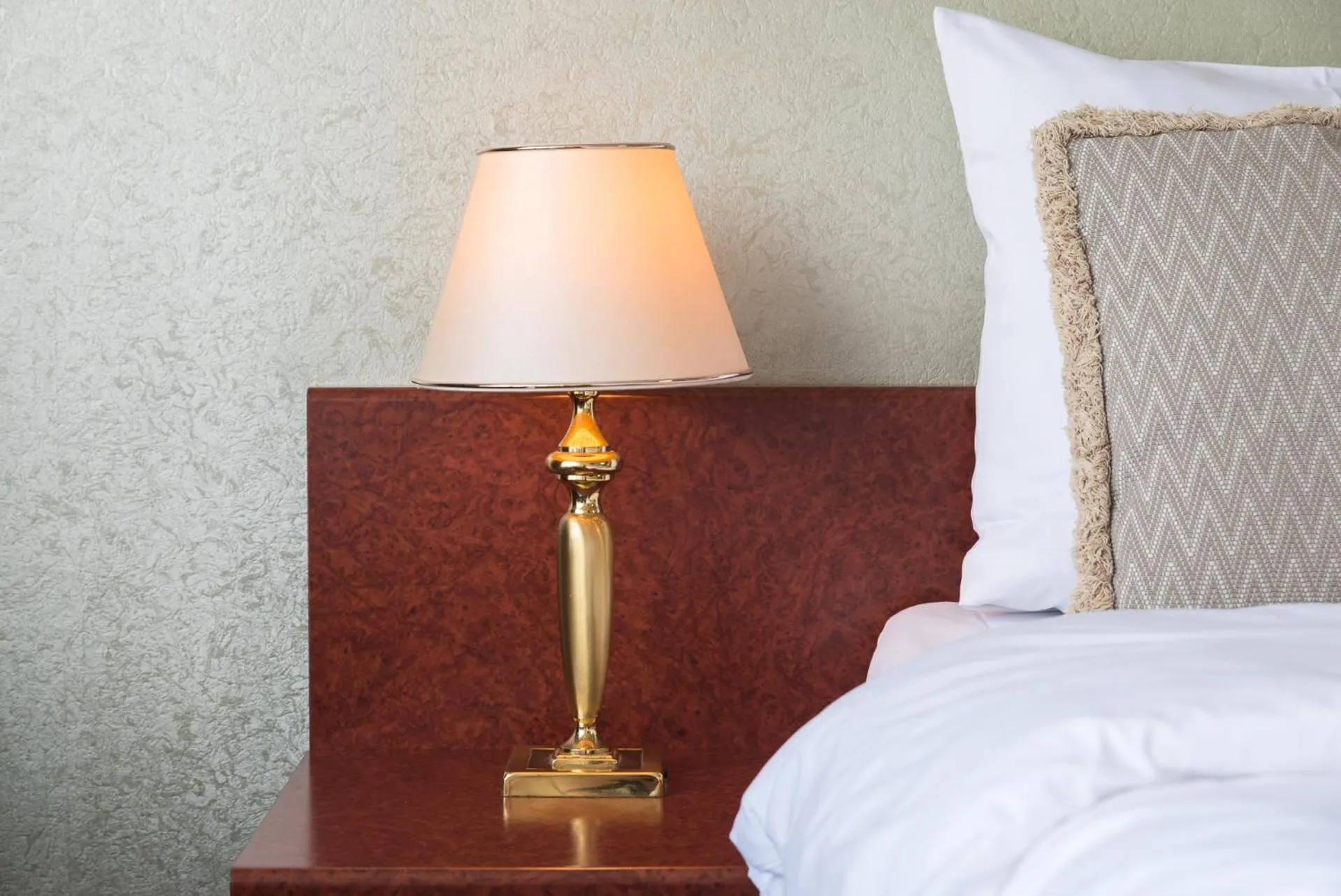 Bed in Prominent Inn Hotel