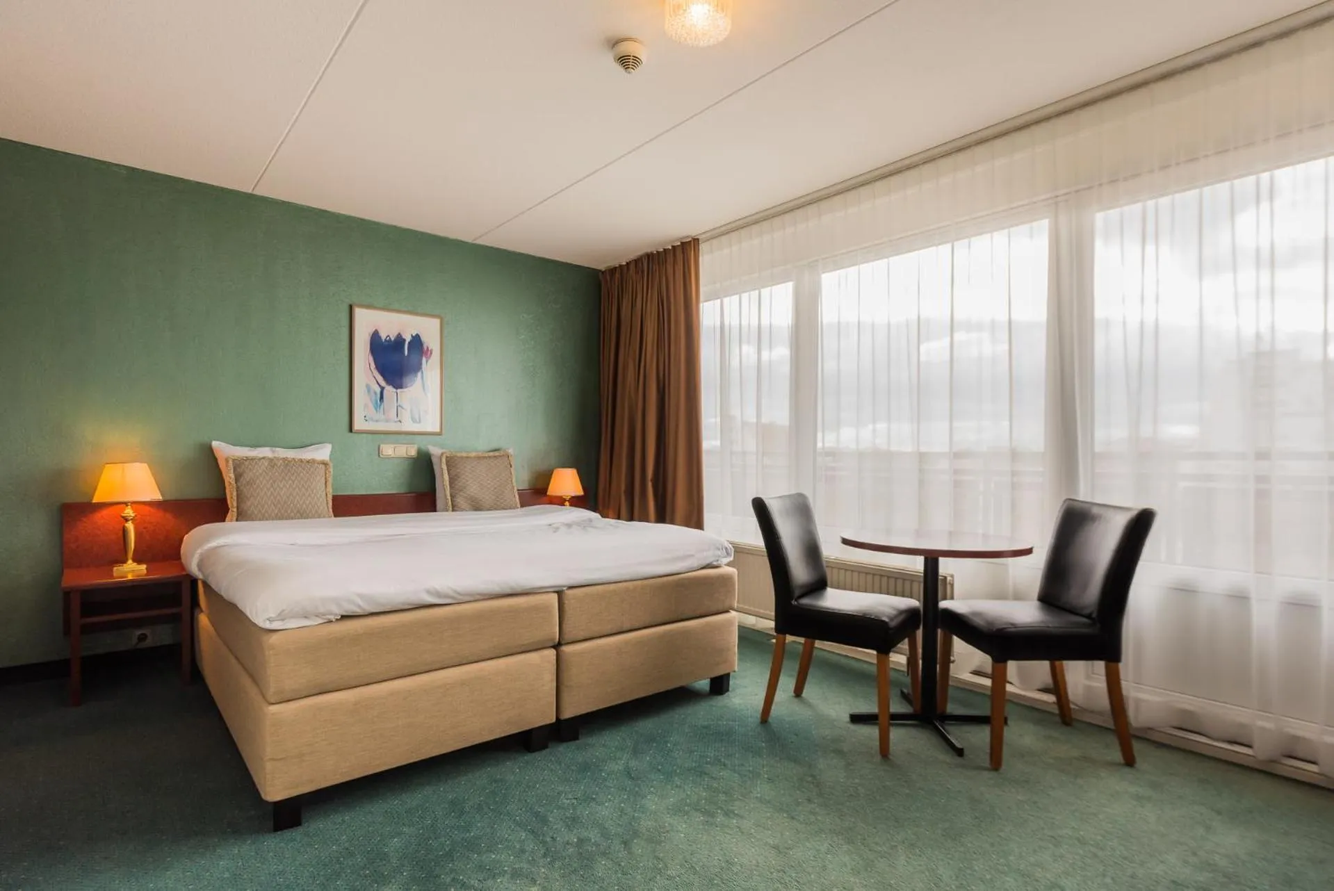 Bed in Prominent Inn Hotel