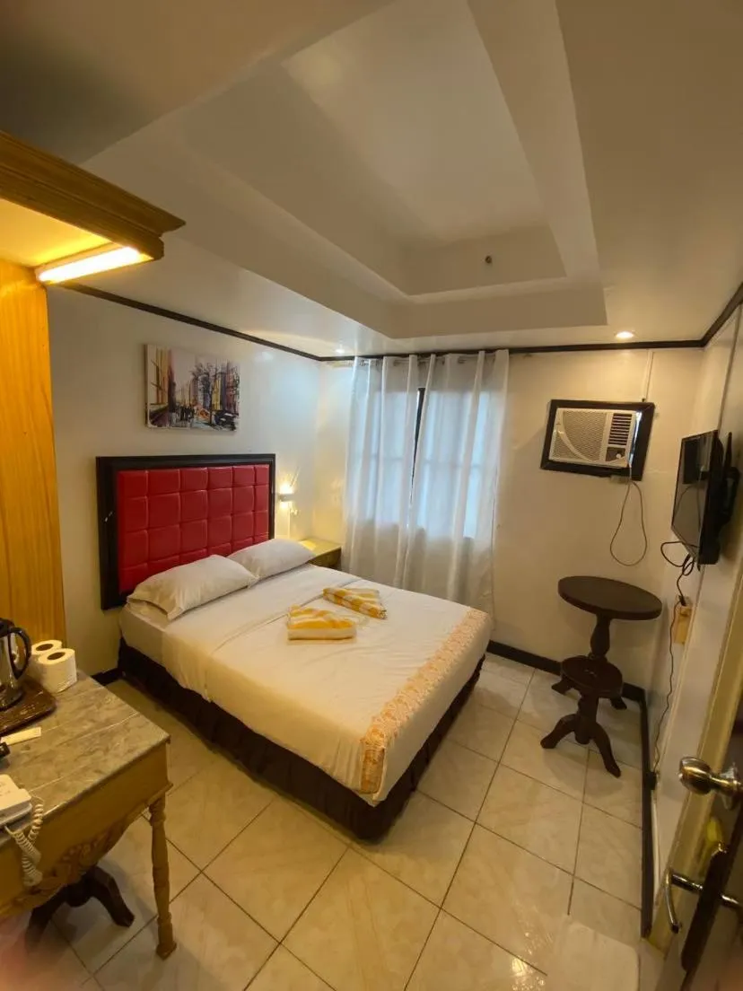 Bed in Sugarland Suites