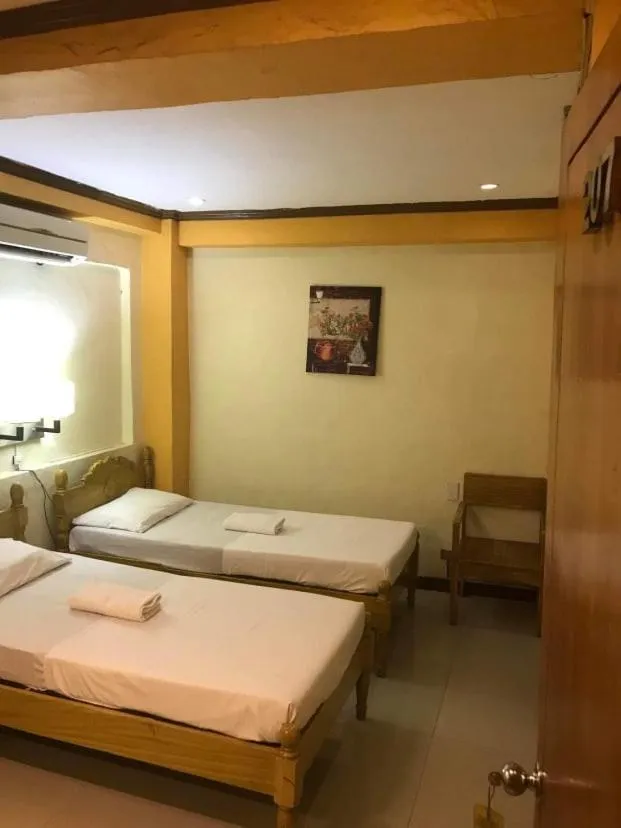 Bed in Sugarland Suites