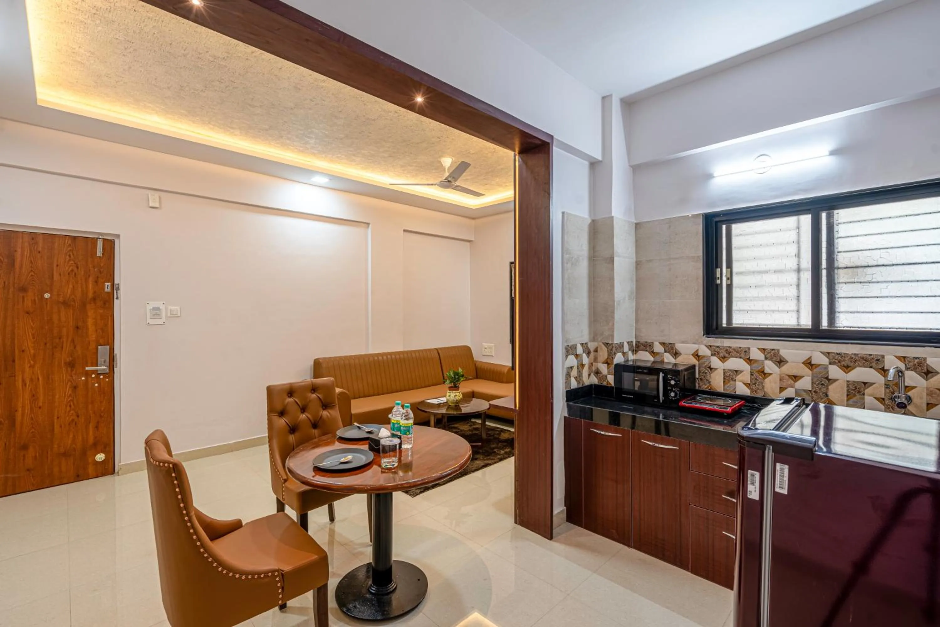 Kitchen or kitchenette in StayBird - Divine Suites, Business Hotel, Kharadi
