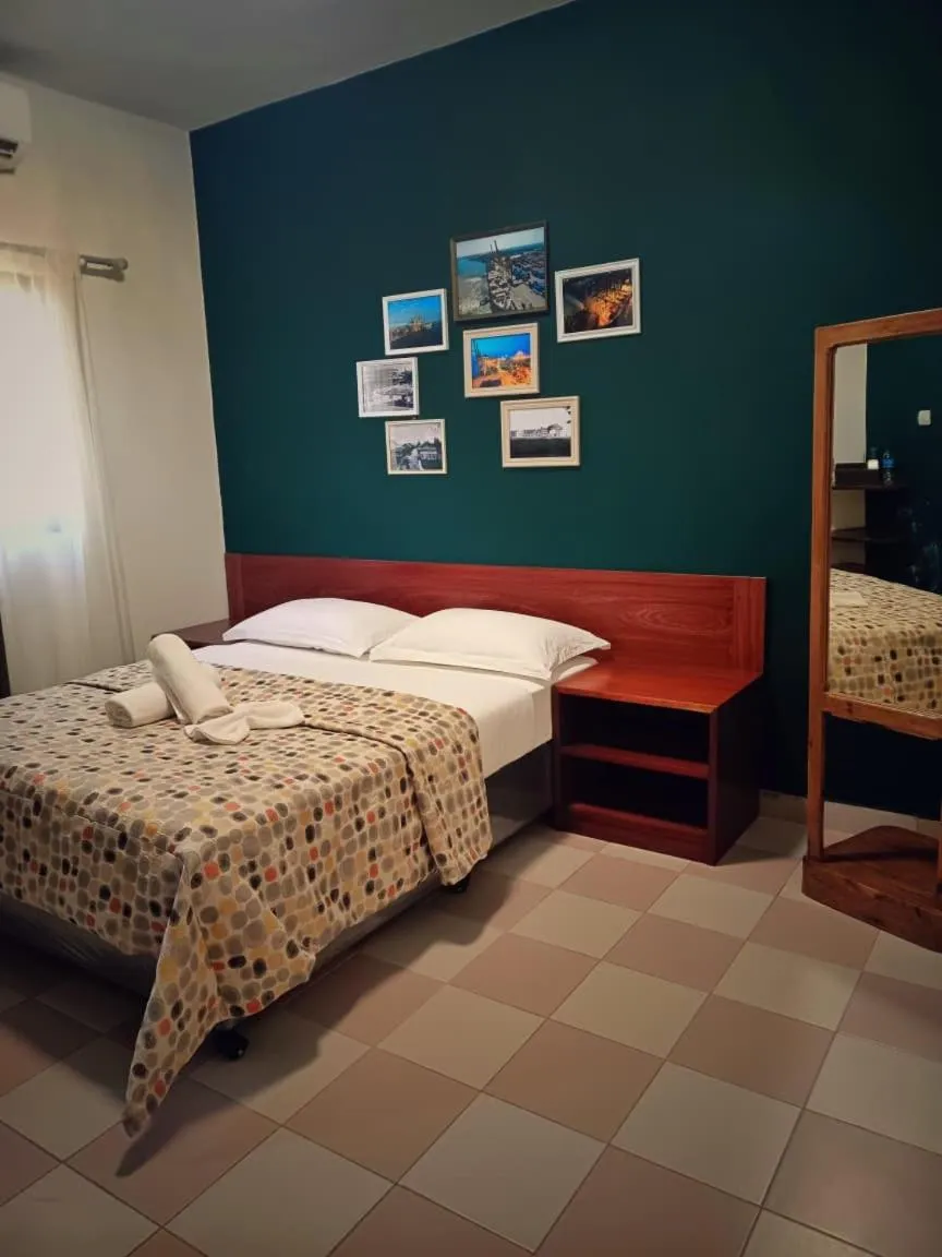 Bed in Hotel Bom Amigo