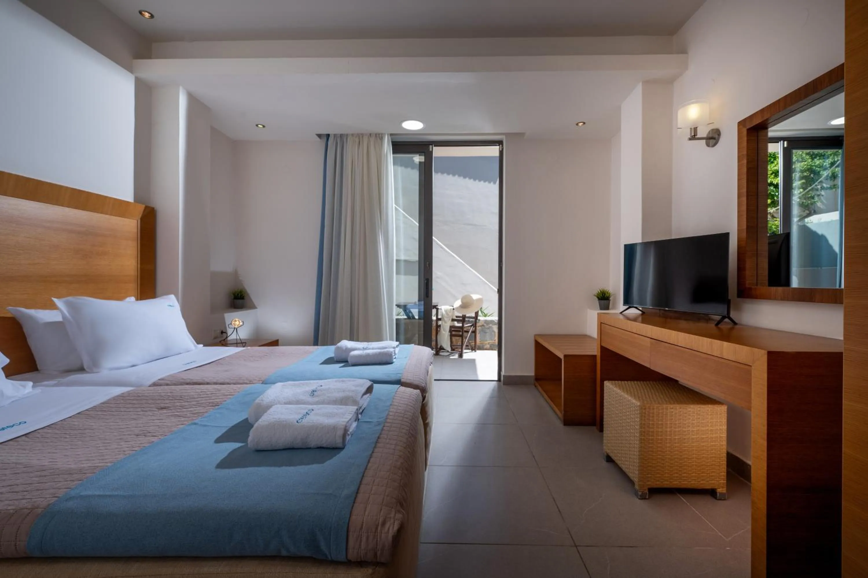 Bed in Creteco Hotel & Suites
