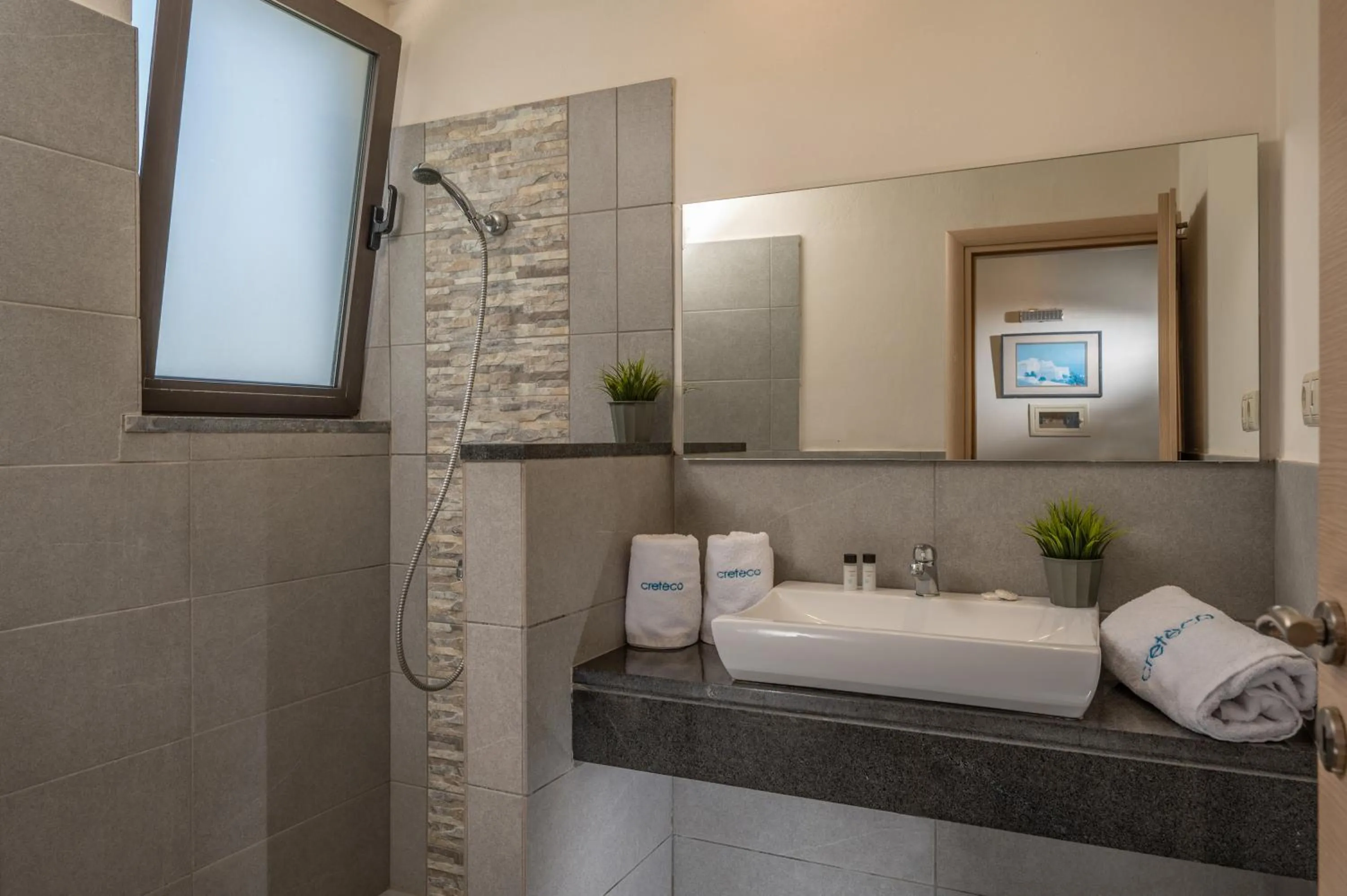 Bathroom in Creteco Hotel & Suites