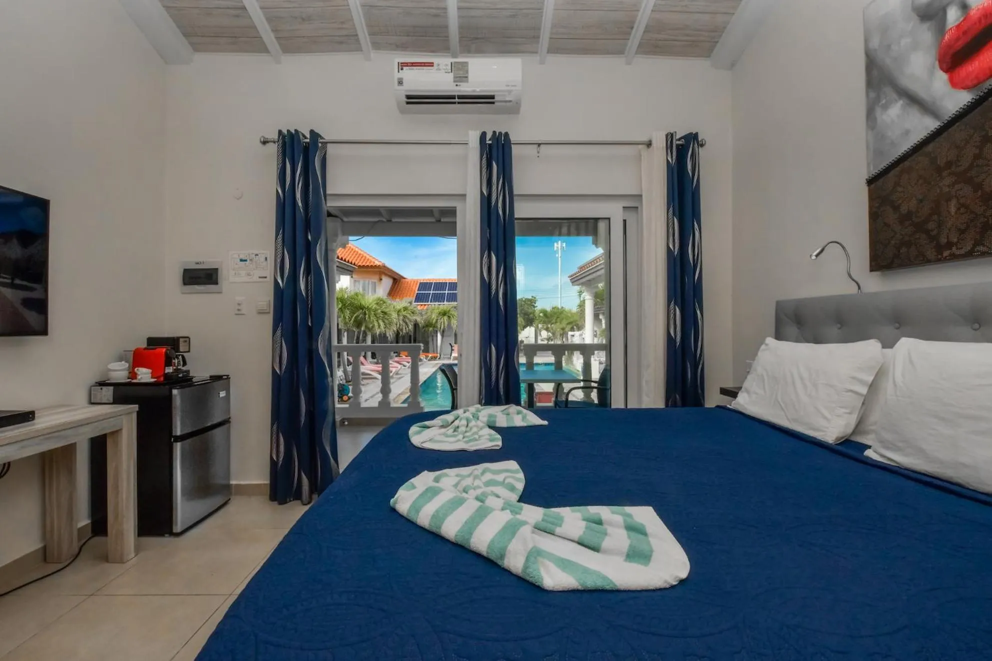 Bed in Boutique Hotel Swiss Paradise Aruba Villas and Suites
