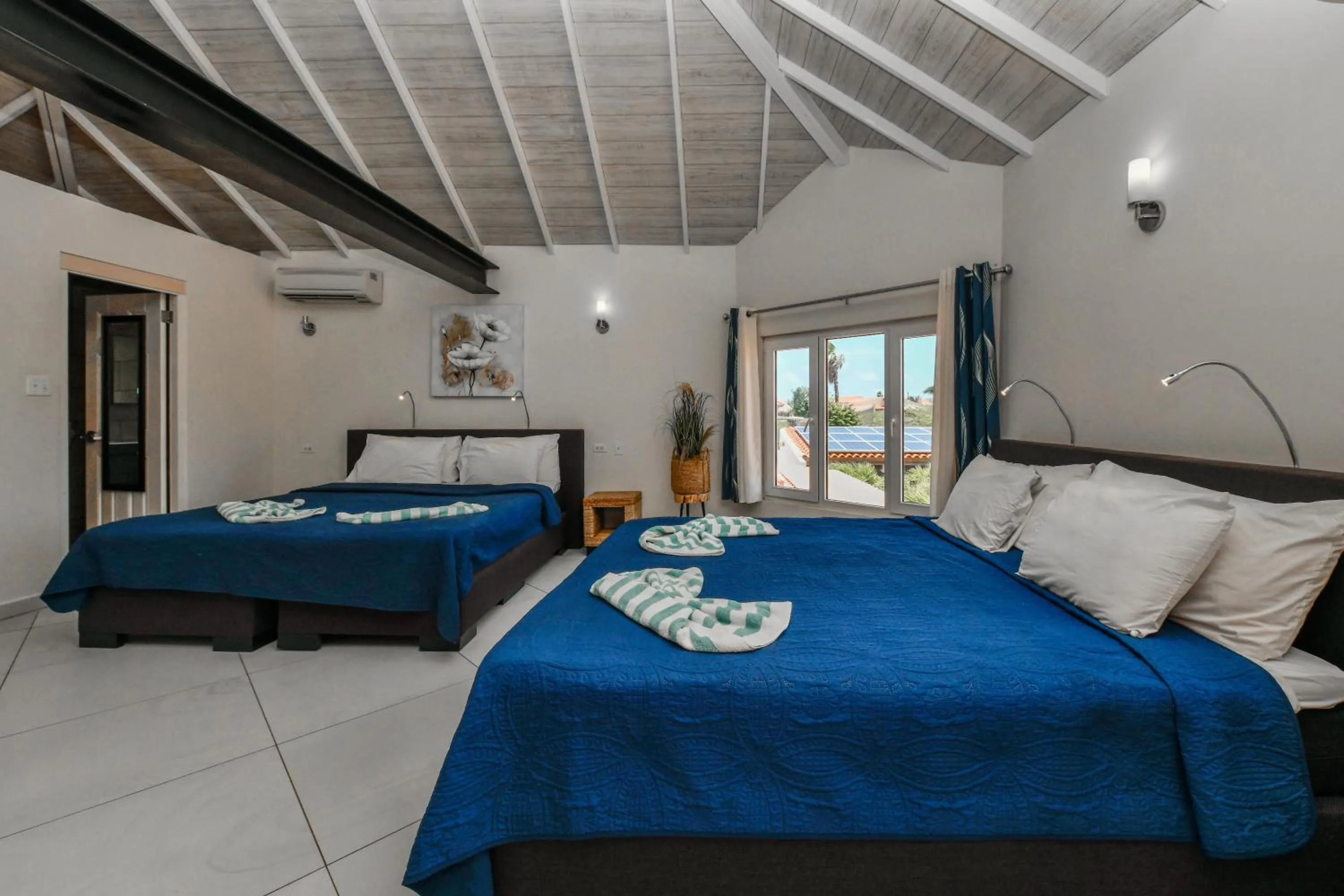 Bed in Boutique Hotel Swiss Paradise Aruba Villas and Suites