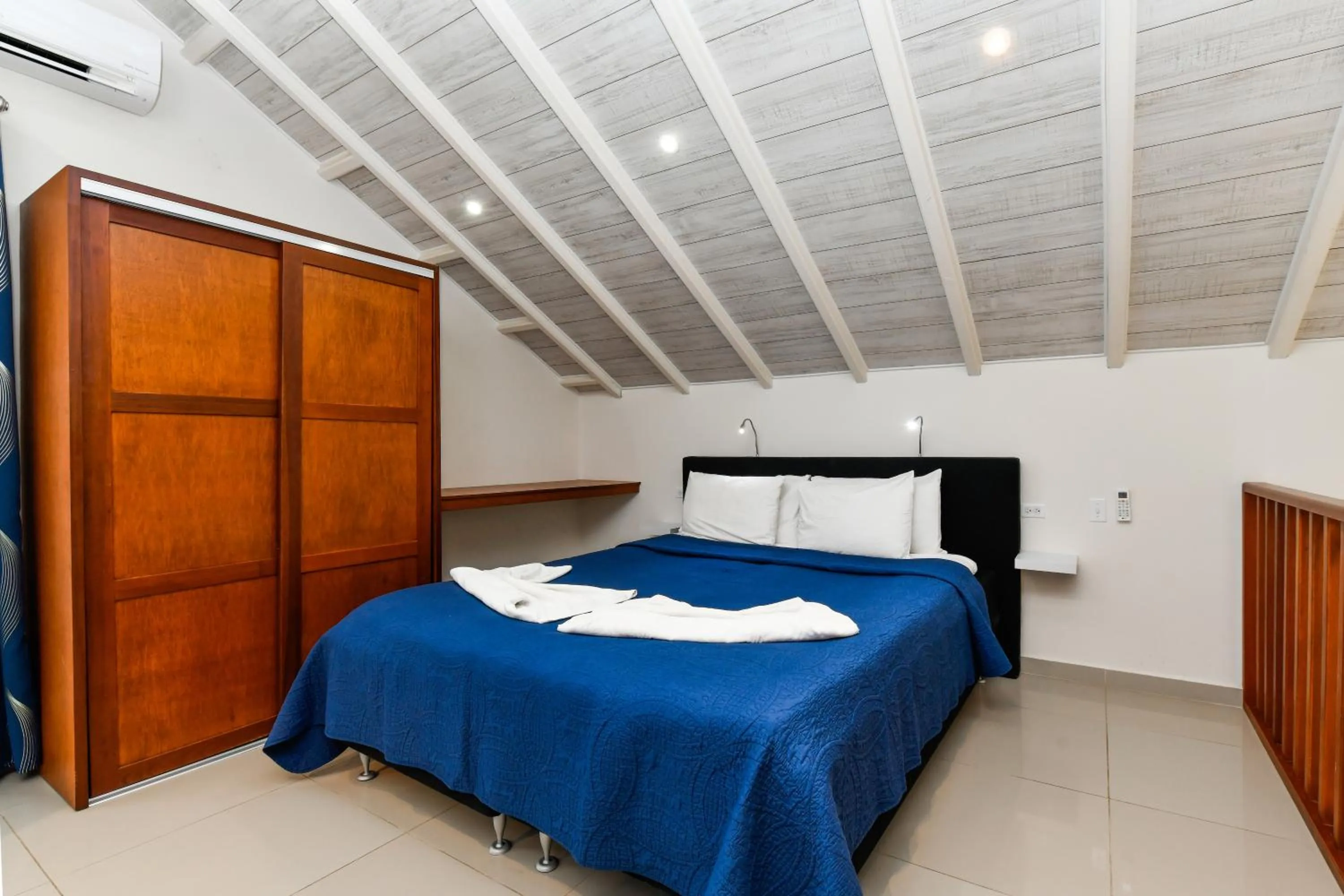 Bed in Boutique Hotel Swiss Paradise Aruba Villas and Suites