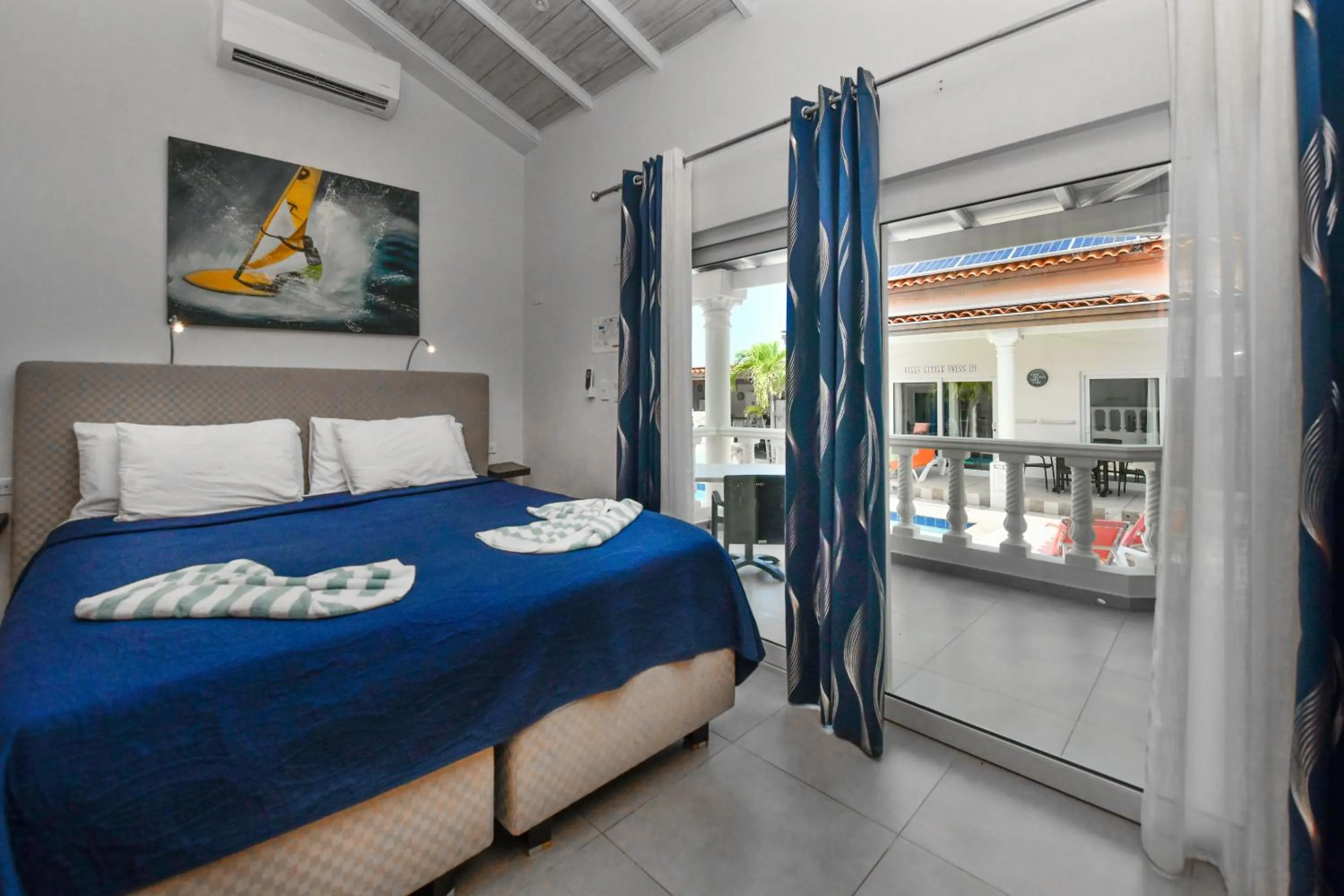 Bed in Boutique Hotel Swiss Paradise Aruba Villas and Suites